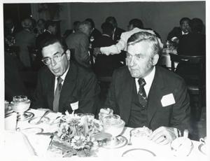 Edward Boland and Silvio Conte seated at a dinner table during the Korean-U.S. Interparliamentary Conference. July 22-23, 1973, 1973-07-22