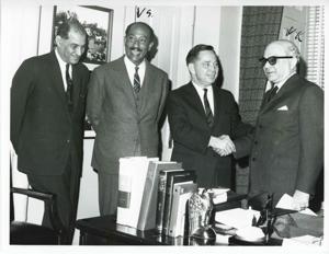 Carl Albert shaking hands with Anwar al Sadat from the United Arab Republic (Egypt) while others look on., 1950-01-01 - 1976-12-31
