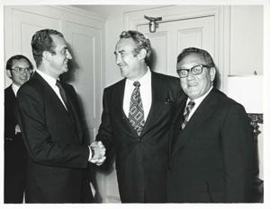 King Juan Carlos of Spain shaking hands with Phillip Burton as Henry Kissinger looks on. June 6, 1976, 1976-06-06