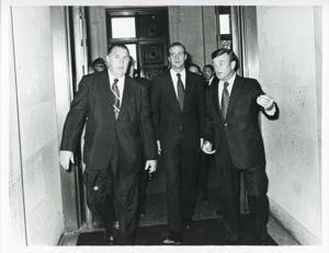 Juan Carlos walking down a corridor with unidentified man., 1976-06-06