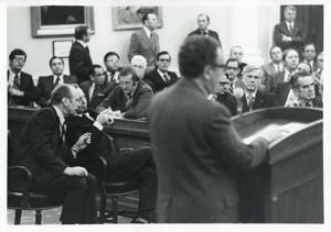 Carl Albert and Gerald R. Ford seated in a room with several other men at an unknown function, and Henry Kissinger is also shown., 1950-01-01 - 1976-12-31