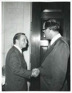Carl Albert shaking hands with an unidentified man., 1950-01-01 - 1976-12-31