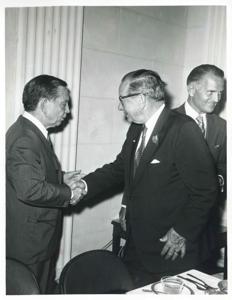 Carl Albert shaking hands with an unidentified man. John Jarman is also pictured., 1950-01-01 - 1976-12-31