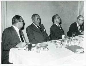 E. T. Dunlap and Carl Albert seated at a dinner table., 1950-01-01 - 1976-12-31