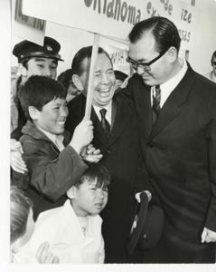 Carl Albert with several unidentified children and a man during his visit to Korea., 1950-01-01 - 1976-12-31