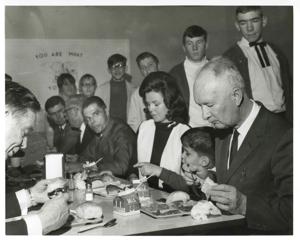 Carl Albert seated at a dinner table with Timmy Faas and others. March of Dimes, 1968, 1969-01-01 - 1969-12-31