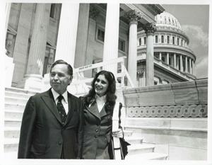 Carl Albert walking down the steps of the Capitol with Felda Looper, the first girl page in the House of Representatives, 1950-01-01 - 1976-12-31
