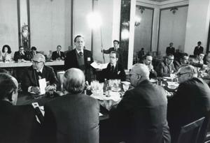 Carl Albert, Robert Michel, Melvin Price, Clement Zablocki, Edward Boland, John Brademas, Millicent Fenwick, and several others seated at a conference table during the House delegation trip to USSR, Romania, Yugoslavia. August 1975, 1975-08-04