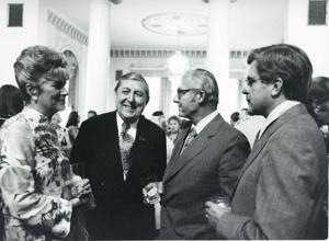Three unidentified men speaking to one another. House delegation trip. August 1975, 1975-08-04