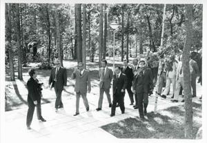 Carl Albert and Mary Albert standing outside with two other men. House delegation trip. August 1975, 1975-08-04