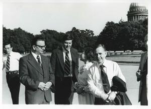 Carl Albert, Clement Zablocki, Melvin Price, and others seated in a room. House delegation trip. August 1975, 1975-08-04