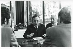 Carl Albert, Edward Boland, and other men standing outside. House delegation trip. August 1975, 1975-08-04