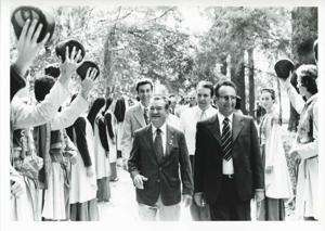 Carl Albert, Melvin Price, John Brademas, seated with others around a conference table. House delegation trip. August 1975, 1975-08-04