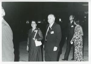 Carl Albert, Edward Boland, and two other men standing outside by a large body of water., 1975-08-04