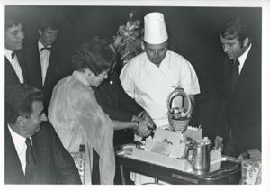 Carl Albert walking with several other people at an airport., 1975-08-04