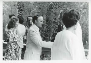 James Quillen standing on a dock. Several boats are in the background., 1975-08-04