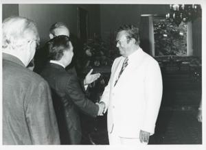 Carl Albert standing with several other people. House delegation trip. August 1975, 1975-08-04