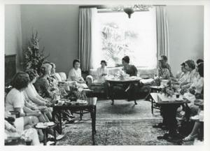Mary Albert seated on a couch with other women. House delegation trip. August 1975, 1975-08-04