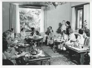 Mary Albert seated on a couch with other women. House delegation trip. August 1975, 1975-08-04