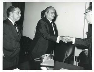 President Josip B. Tito shaking hands with an unidentified man as Albert looks on., 1971-11-01