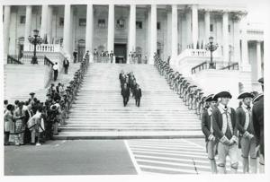 Carl Albert, Nelson Rockefeller, John Rhodes, John McFall, Robert C. Byrd, the Sergeant-at-Arms, John Brademas, and others on the steps of the U. S. Capitol. On the side of the steps are men in Revolutionary War costumes. During Queen Elizabeth&#39;s visit to Congress, 1976, 1976-07-06