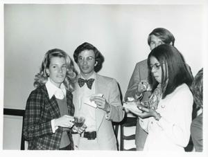 Joel Jankowsky and Loise Butler standing with two other unidentified people at Carole Howard&#39;s farewell party., 1950-01-01 - 1976-12-31