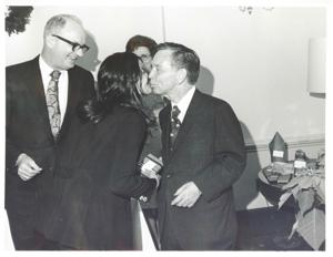 Charles L. Ward, Carl Albert and Kathy Kwock at the Office Christmas party. Albert is kissing Kwock., 1971-12-01