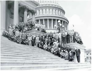 Large group of unidentified men standing or seated on the Capitol steps. Carl Albert is present., 1950-01-01 - 1976-12-31