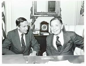 ["Black and white photograph print of Carl Albert with two unidentified men."]