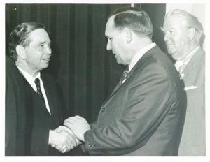 Carl Albert shaking hands with an unidentified man., 1950-01-01 - 1976-12-31
