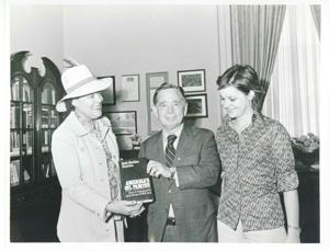 Carl Albert standing with Ruth Sheldon Knowles, author of America&#39;s Oil Famine, and Caroll-Lois Knowles. May 23, 1975, 1975-05-23