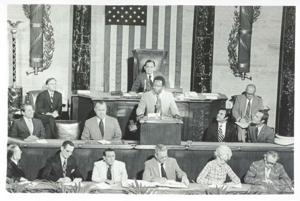 Hank Aaron speaking before members of Congress during the Flag Day Ceremonies. Carl Albert is seated behind Aaron. July 14, 1974, 1950-01-01 - 1976-12-31