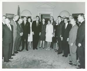 Carl Albert, Les Arends, Charles Halleck, Bob Hope, Dolores Hope, and John F. Kennedy posing with a large group of people., 1950-01-01 - 1976-12-31