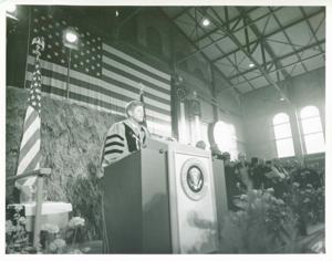President John F. Kennedy speaking at a ceremony, possibly a graduation., 1950-01-01 - 1976-12-31