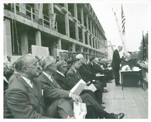 Carl Albert, John F. Kennedy, Earl Warren, with others at the Rayburn building dedication. John W. McCormack is speaking., 1965-01-06