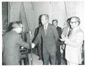 Carl Albert shaking hands with an unidentified man., 1950-01-01 - 1976-12-31