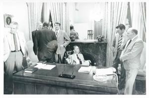 Carl Albert seated at his desk. Several men are seated around the desk., 1950-01-01 - 1976-12-31