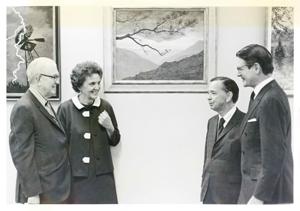 Tom Steed, Carl Albert and Eliot Richardson, speaking with an unidentified woman., 1950-01-01 - 1976-12-31