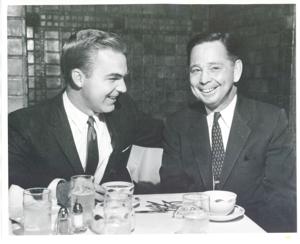Carl Albert seated at a dinner table with an unidentified man., 1950-01-01 - 1976-12-31