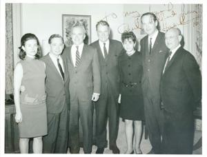 Carl Albert standing with Hale Boggs and several other people. The inscription of the photograph reads: To my friend Carl Albert. From Hale Boggs., 1950-01-01 - 1976-12-31