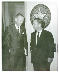 Carl Albert standing and talking with an unidentified woman., 1950-01-01 - 1976-12-31