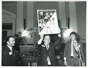 Carl Albert holding up his new portrait of Oklahoma football on his birthday. 1976, 1976-05-10
