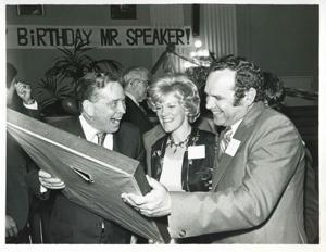 Carl Albert holding up his new portrait of Oklahoma football on his birthday. 1976, 1976-05-10