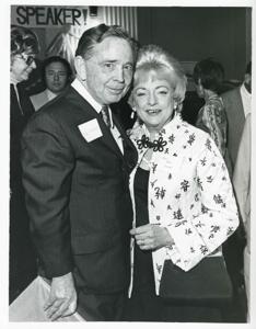 Carl Albert standing with Mrs. Dan Flood at his birthday party, 1976, 1976-05-10
