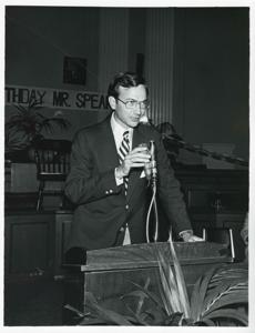 An unidentified man speaking at a podium at Carl Albert&#39;s birthday party, 1976, 1976-05-10