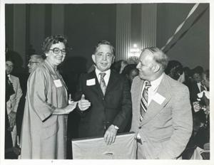 Carl Albert speaking with Irene Oney and Joseph P. Addabbo at his birthday party, 1976, 1976-05-10