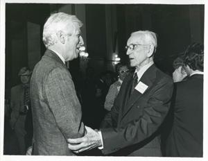 John W. McCormack shaking hands with an unidentified man at Carl Albert&#39;s birthday party, 1976, 1976-05-10