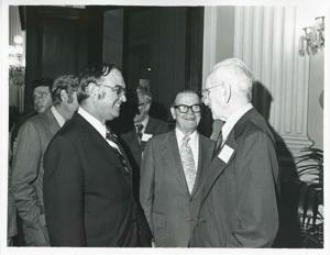 John W. McCormack shaking hands with an unidentified man at Carl Albert&#39;s birthday party, 1976, 1976-05-10