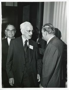 John W. McCormack shaking hands with an unidentified man at Carl Albert&#39;s birthday party, 1976, 1976-05-10