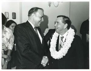 Carl Albert shaking hands with an unidentified man. Albert&#39;s birthday, May 10, 1974, 1974-05-10